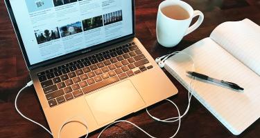 Stock photo of a laptop and coffee