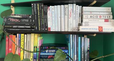 Rectangular photo of Rachel Nuwer’s office bookshelf with books on neuroscience and psychoactive drugs. Photo credit Rachel Nuwer.