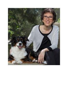 Portrait photo of Wendy Lyons Sunshine and her dog Bernie in an outdoor setting.