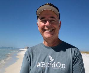 Portrait photo of Sneed B. Collard III on a beach near Eglin Air Force Base. 