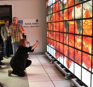 Christopher E. Henze demonstrates the analytical and visualization capabilities of the 128-screen Hyperwall.