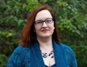 Portrait photo of Olivia Campbell in an outdoor setting.