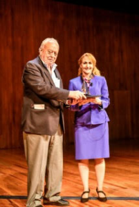 CASW executive director emeritus Ben Patrusky presents Jo Handelsman with an engraved crystal prism commemorating her Patrusky Lecture.