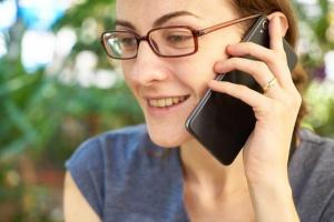 A photo of a woman talking on the phone